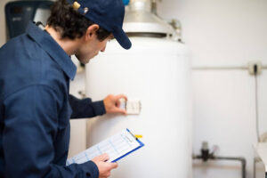 Air Specialties technician servicing water heater.